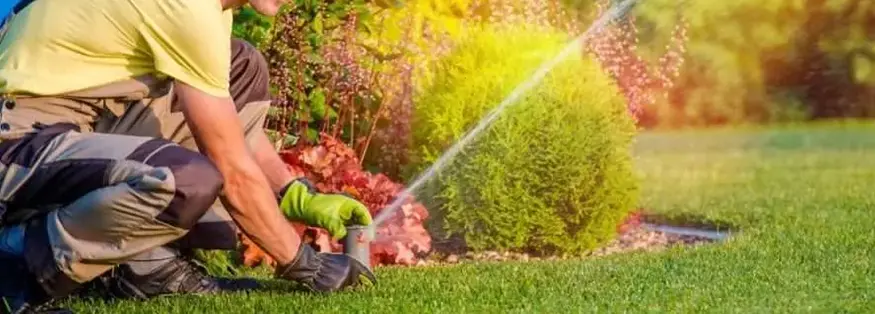 Man Repairing Irrigation System