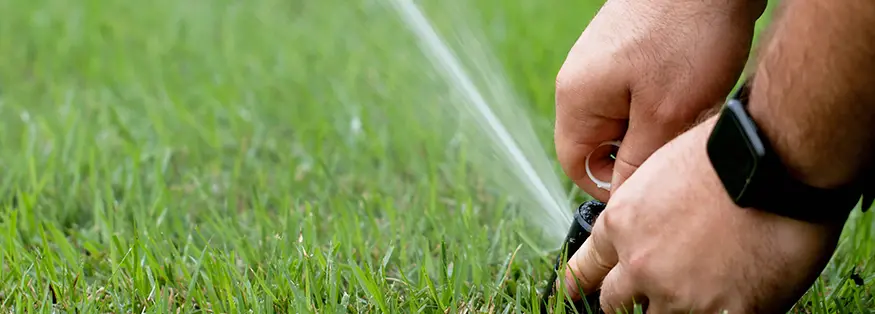 Man Repairing Sprinkler System